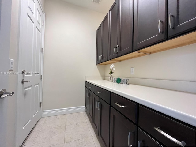8248 Lost Creek Ln, Delray Beach, FL 33446 - laundry room with baseboards