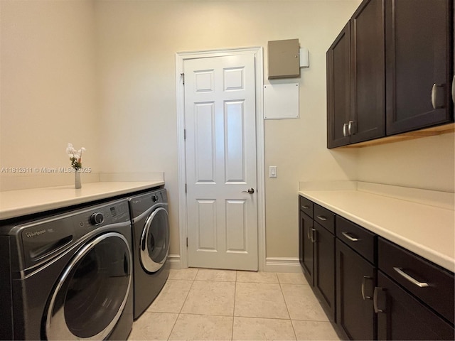 8248 Lost Creek Ln, Delray Beach, FL 33446 - laundry area with cabinet space, washing machine and dryer, light tile patterned floors, and baseboards