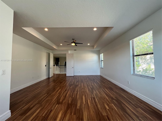 8248 Lost Creek Ln, Delray Beach, FL 33446 - unfurnished room with dark wood-type flooring, baseboards, recessed lighting, a tray ceiling, and ceiling fan
