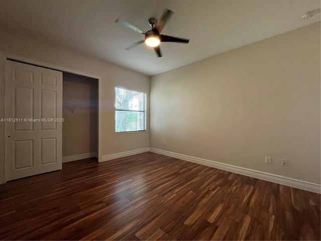 8248 Lost Creek Ln, Delray Beach, FL 33446 - unfurnished bedroom featuring dark wood finished floors, baseboards, a closet, and ceiling fan