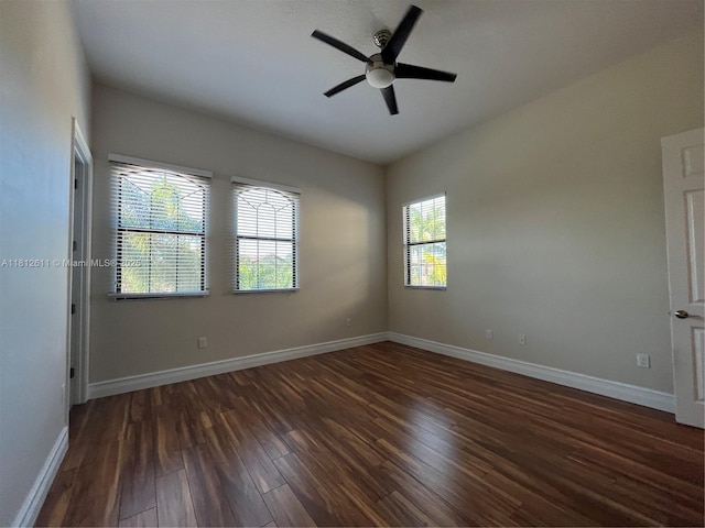 8248 Lost Creek Ln, Delray Beach, FL 33446 - empty room with dark wood-style flooring, ceiling fan, and baseboards
