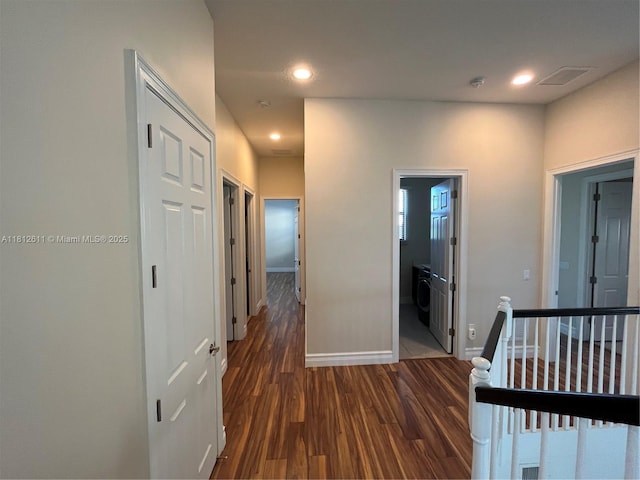 8248 Lost Creek Ln, Delray Beach, FL 33446 - hallway with dark wood-style flooring, an upstairs landing, baseboards, recessed lighting, and washer / dryer