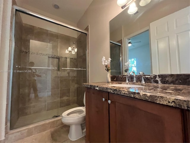 8248 Lost Creek Ln, Delray Beach, FL 33446 - full bath featuring vanity, toilet, tile patterned flooring, a stall shower, and ceiling fan
