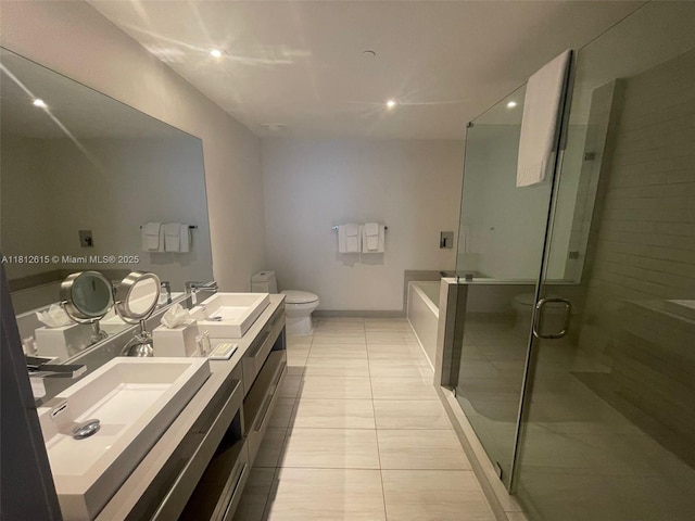 4010 S Ocean Dr Unit R1705, Hollywood, FL 33019 - full bath with double vanity, toilet, a stall shower, tile patterned flooring, and recessed lighting
