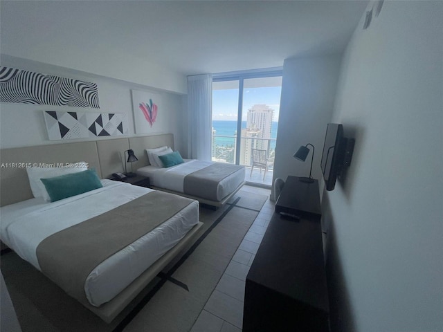 4010 S Ocean Dr Unit R1705, Hollywood, FL 33019 - bedroom with expansive windows and tile patterned flooring