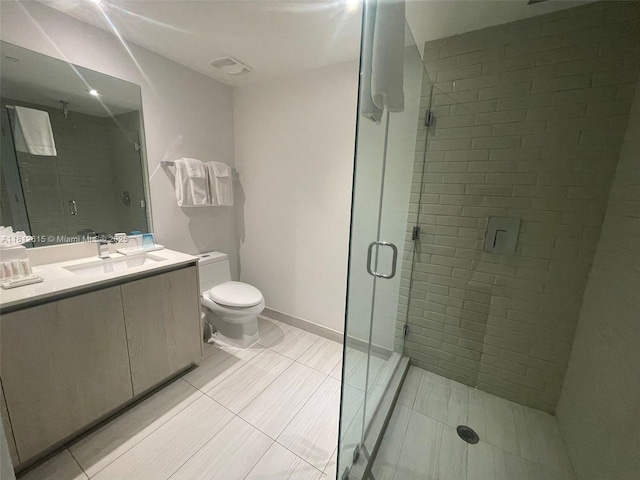 4010 S Ocean Dr Unit R1705, Hollywood, FL 33019 - bathroom with vanity, a stall shower, toilet, baseboards, and tile patterned floors