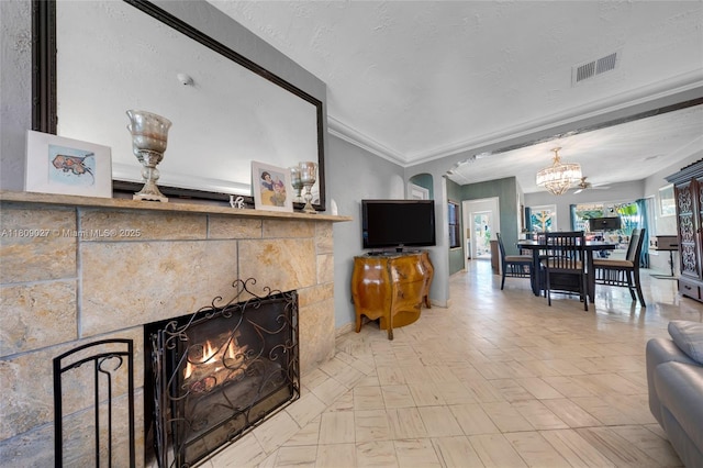 703 NE 88th St, Miami, FL 33138 - living area with a chandelier, ornamental molding, baseboards, and arched walkways