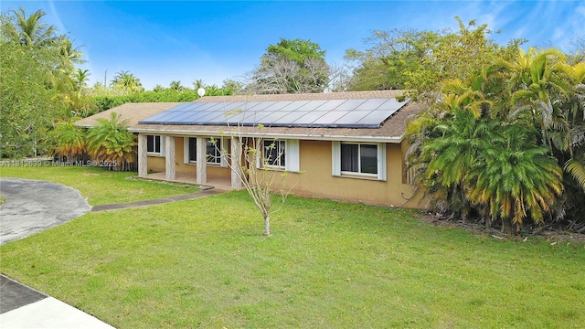 17501 SW 89th Ave, Palmetto Bay, FL 33157 - single story home with a front lawn, solar panels, and stucco siding