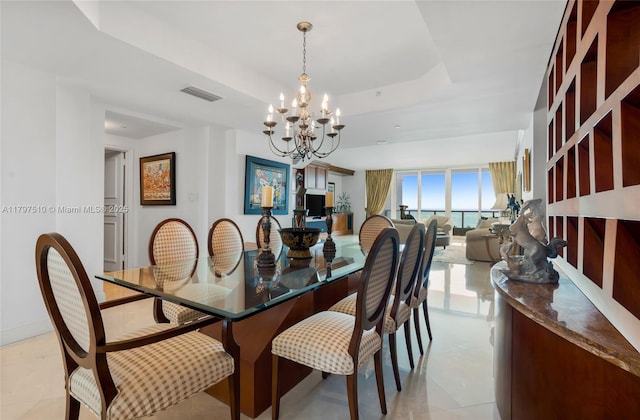 19955 NE 38th Ct Unit 2204, Aventura, FL 33180 - dining area featuring a tray ceiling and a chandelier