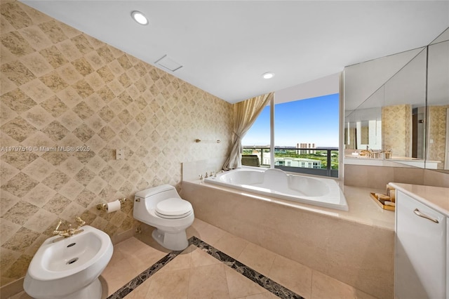 19955 NE 38th Ct Unit 2204, Aventura, FL 33180 - bathroom with a bidet, a garden tub, recessed lighting, toilet, and vanity