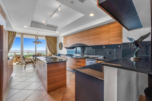 19955 NE 38th Ct Unit 2204, Aventura, FL 33180 - kitchen with a tray ceiling, expansive windows, dishwasher, tasteful backsplash, and a center island