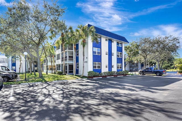 3170 Holiday Springs Blvd Unit 6-209, Margate, FL 33063 - view of building exterior with uncovered parking