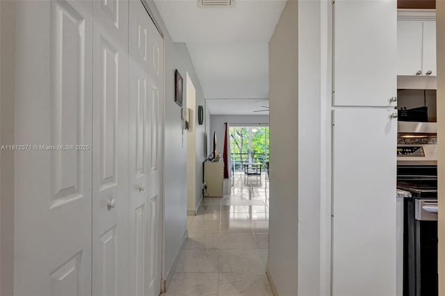 3170 Holiday Springs Blvd Unit 6-209, Margate, FL 33063 - corridor featuring light marble finish floors and baseboards