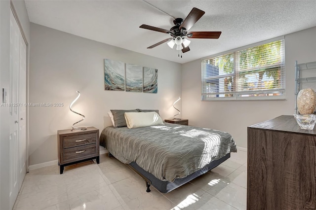 3170 Holiday Springs Blvd Unit 6-209, Margate, FL 33063 - bedroom featuring baseboards, ceiling fan, and light marble finish flooring