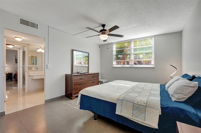 3170 Holiday Springs Blvd Unit 6-209, Margate, FL 33063 - tiled bedroom featuring a textured ceiling and a ceiling fan