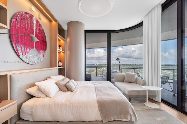 8701 Collins Ave Unit 905, Miami Beach, FL 33154 - bedroom featuring floor to ceiling windows, multiple windows, and access to outside
