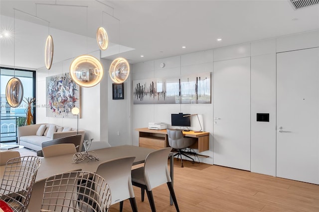 8701 Collins Ave Unit 905, Miami Beach, FL 33154 - dining area featuring light wood-type flooring, a desk, and recessed lighting