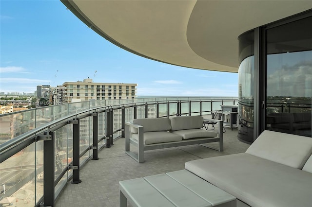 8701 Collins Ave Unit 905, Miami Beach, FL 33154 - balcony featuring an outdoor hangout area, a water view, wine cooler, and a view of city