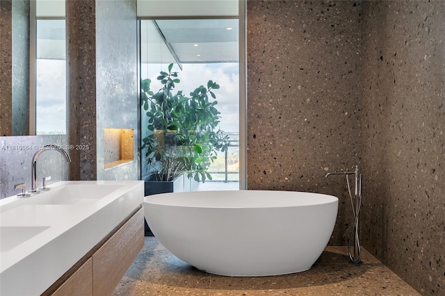 8701 Collins Ave Unit 905, Miami Beach, FL 33154 - bathroom with a freestanding bath and double vanity
