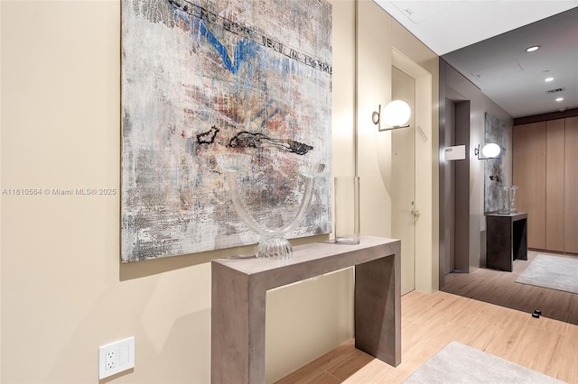 8701 Collins Ave Unit 905, Miami Beach, FL 33154 - hallway with wood finished floors and recessed lighting