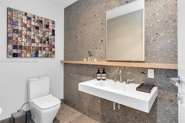 8701 Collins Ave Unit 905, Miami Beach, FL 33154 - bathroom with toilet and tile walls
