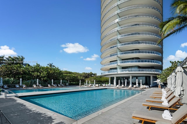 8701 Collins Ave Unit 905, Miami Beach, FL 33154 - community pool featuring a patio