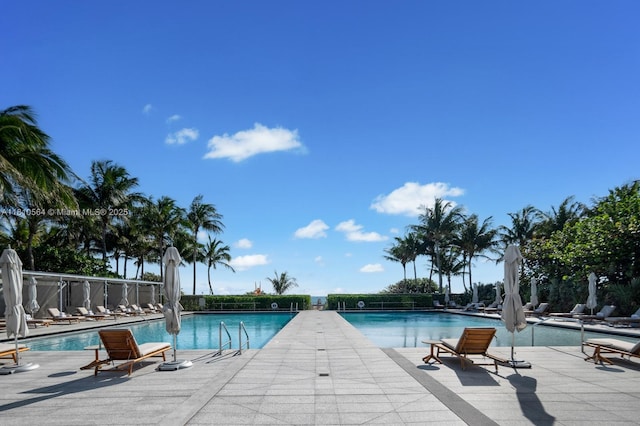 8701 Collins Ave Unit 905, Miami Beach, FL 33154 - community pool featuring a patio area