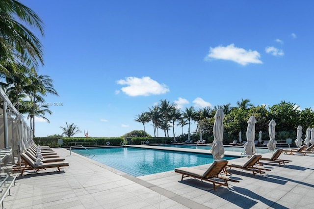 8701 Collins Ave Unit 905, Miami Beach, FL 33154 - community pool featuring a patio area