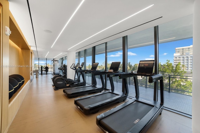 8701 Collins Ave Unit 905, Miami Beach, FL 33154 - exercise room with a wall of windows