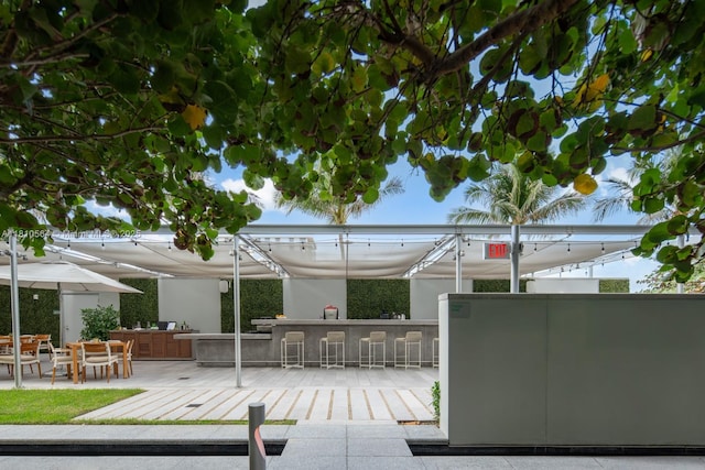 8701 Collins Ave Unit 905, Miami Beach, FL 33154 - view of patio / terrace with a bar