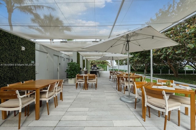 8701 Collins Ave Unit 905, Miami Beach, FL 33154 - view of patio with outdoor dining area