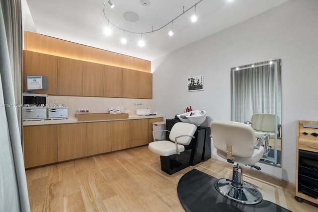 8701 Collins Ave Unit 905, Miami Beach, FL 33154 - kitchen featuring light wood-style floors, light countertops, and modern cabinets