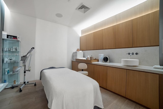 8701 Collins Ave Unit 905, Miami Beach, FL 33154 - bedroom with light wood-style flooring