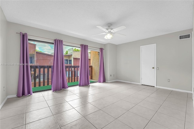 6934 SW 114th Pl Unit A55, Miami, FL 33173 - tiled spare room featuring a ceiling fan, baseboards, and a textured ceiling