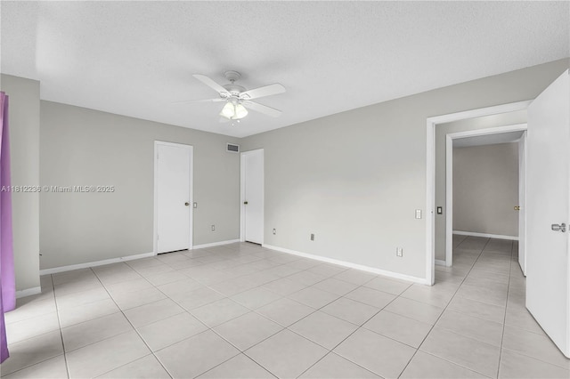 6934 SW 114th Pl Unit A55, Miami, FL 33173 - empty room featuring ceiling fan, baseboards, light tile patterned floors, and a textured ceiling