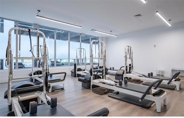 7661 NW 107th Ave Unit 303, Doral, FL 33178 - gym with wood finished floors