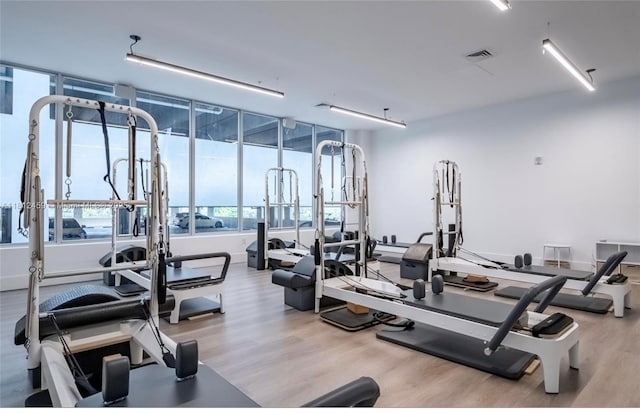 7661 NW 107th Ave Unit 303, Doral, FL 33178 - gym with wood finished floors