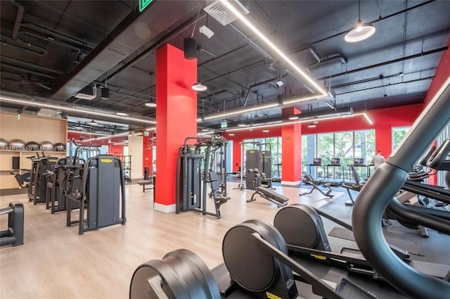7661 NW 107th Ave Unit 303, Doral, FL 33178 - gym featuring wood finished floors and baseboards