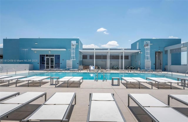 7661 NW 107th Ave Unit 303, Doral, FL 33178 - community pool featuring a patio area