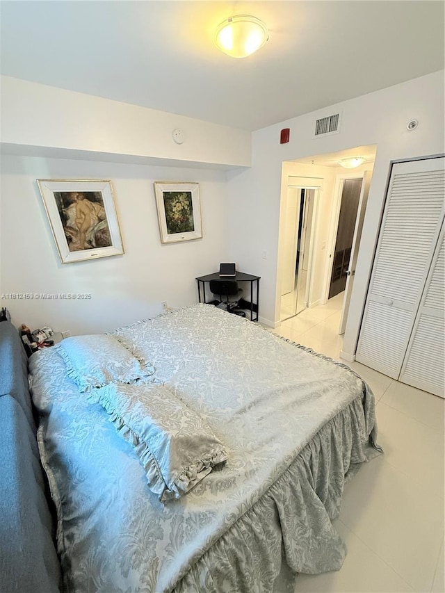 7661 NW 107th Ave Unit 303, Doral, FL 33178 - bedroom featuring light tile patterned flooring