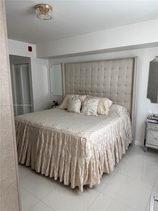 7661 NW 107th Ave Unit 303, Doral, FL 33178 - bedroom featuring light tile patterned floors