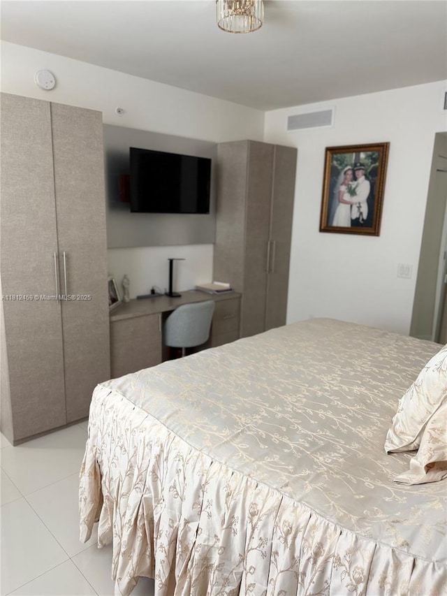 7661 NW 107th Ave Unit 303, Doral, FL 33178 - bedroom with light tile patterned flooring