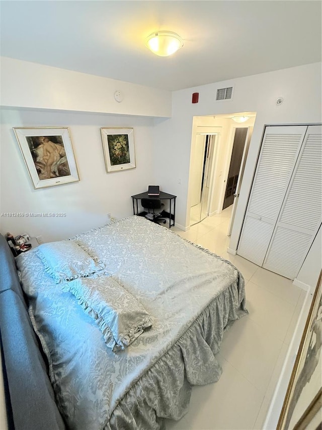 7661 NW 107th Ave Unit 303, Doral, FL 33178 - bedroom with light tile patterned floors