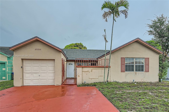 20316 NW 32nd Path, Miami Gardens, FL 33056 - view of front of home featuring stucco siding, a garage, roof with shingles, and driveway