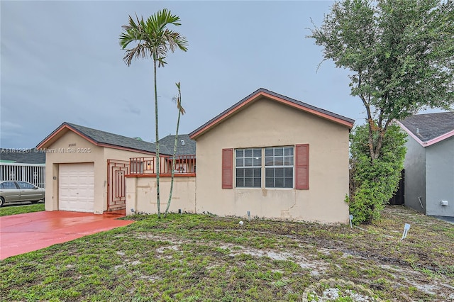 20316 NW 32nd Path, Miami Gardens, FL 33056 - view of front of house featuring stucco siding, a garage, and driveway