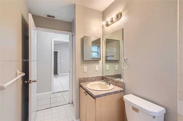 20316 NW 32nd Path, Miami Gardens, FL 33056 - bathroom featuring toilet, vanity, and tile patterned floors