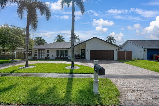2750 SW 86th Way, Davie, FL 33328 - single story home featuring curved driveway, a garage, and stucco siding
