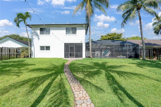 2750 SW 86th Way, Davie, FL 33328 - back of property with stucco siding, glass enclosure, and a sunroom