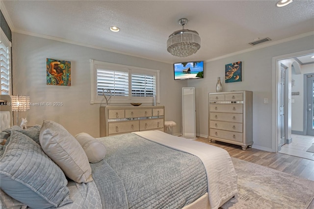 2750 SW 86th Way, Davie, FL 33328 - bedroom with wood finished floors, ornamental molding, baseboards, a textured ceiling, and recessed lighting