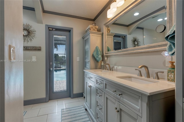 2750 SW 86th Way, Davie, FL 33328 - bathroom with double vanity, crown molding, tile patterned flooring, and baseboards